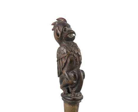 A BETEL NUT CRUSHERBali or Lombok, 19th centuryThe wooden lid carved as a kneeling winged beast. offered at auction together 