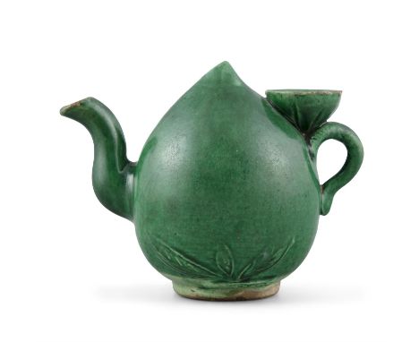 A GREEN GLAZED PEACH SHAPED ‘CADOGAN’ BISCUIT TEAPOTChina, Qing Dynasty, Kangxi periodNaturalistically shaped as a peach of l