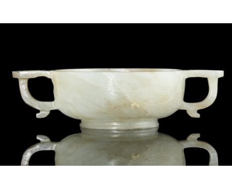 A JADE ‘PLUM AND LOTUS’ TWO-HANDLED CUP INSCRIBED WITH THE SEAL MARK OF LU ZIGANG 子冈China, Attributed to Ming Dynasty, 16th-1