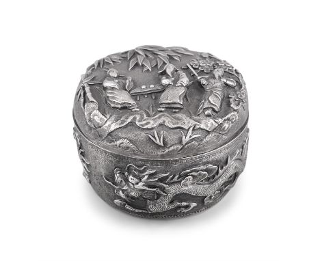 A DEEPLY CHISELLED CHINESE EXPORT SILVER ROUND BOX AND COVER  China, Late Qing Dynasty, Circa 1900 The lid adorned with three