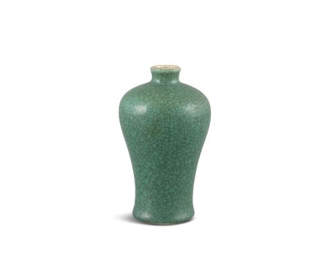 A SMALL APPLE-GREEN- CRACKLED-GLAZED MEIPING VASEChina, Qing Dynasty, Presumably Kangxi periodThe miniature vase resting on a