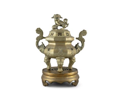 A LARGE BRASS INCENSE BURNER, LID AND STANDVietnam, 20th centuryThe lid topped by a Foo Do dog finial.H (total, together with