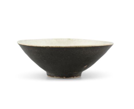 A TEMMOKU TYPE STONEWARE BOWLPresumably Vietnam and Tran DynastyThickly potted, of conical shape, resting on an unglazed ring