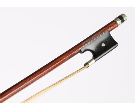 A pernumbuco violin bow, 29" long with silver metal tip, frog in channelled stick and abalone slide. Marked Vuillaume - Paris