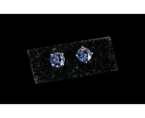 Colour Change Fluorite Stud Earrings, the round cut 2cts of blue fluorite turn a deep pinkish purple in incandescent light, a