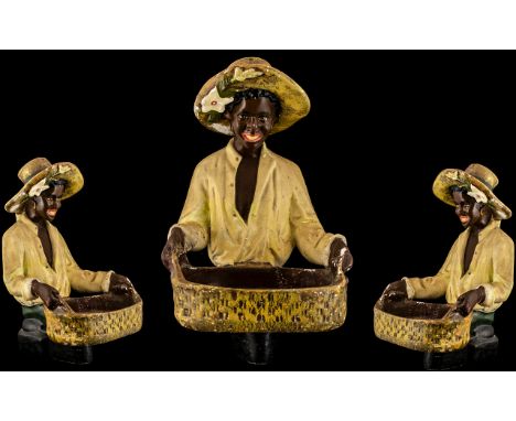Goldscheider Style 1920s Shop Display of a young black plantation worker holding a basket; 15.5 inches (38.75cms) high. A/F C