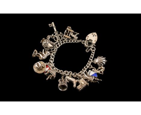 Vintage Sterling Silver Bracelet Loaded with 16 Silver Charms. All Links to Bracelet Marked with Lion Passant. All Charms Mar