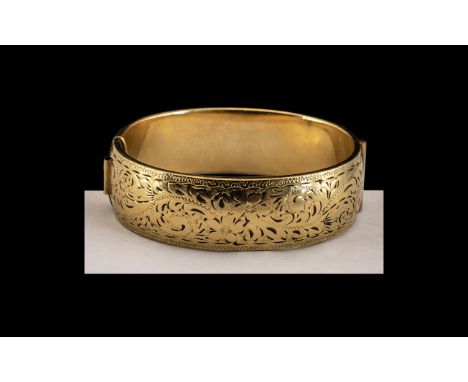 9ct Gold Bangle and Metal Core, Lovely Floral Decoration with Hinged Clasp. Large Size - Diameter 6.5 cms. 40 grams. 