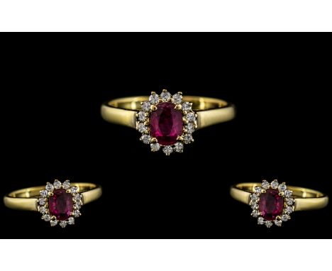 18ct Gold - Attractive Diamond and Ruby Set Dress Ring - Flower head Setting. Marked 18ct to Interior of Shank. The Central R