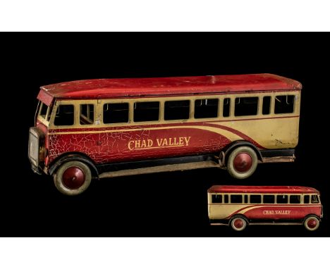 Early 20th Century Chad Valley Tinplate Bus, a wind-up tinplate bus in original Chad Valley paint; 12 inches (30cms) long