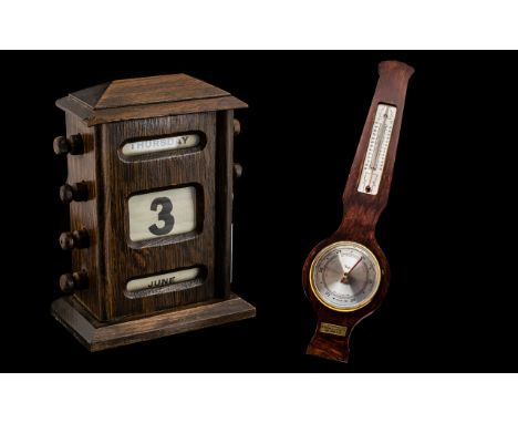 Edwardian Oak Cased Perpetual Calendar measures width 12.5 cm, height 18 cm, depth 8 cm. Together with a Taylor Stormguide Ba