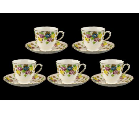 Tuscan China Set of five cups and saucers 'Plant' pattern, white ground with floral and leaf pattern and gilt trim.  Pretty s