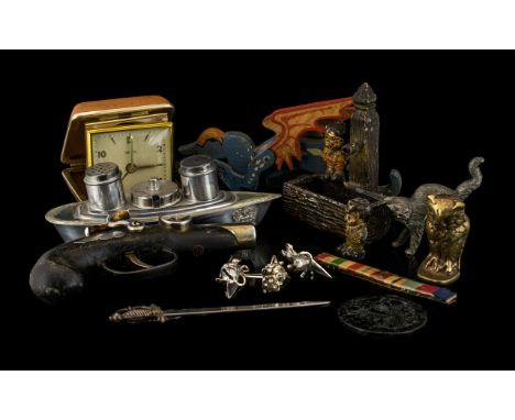 Box of Collectibles to include a lighter in the form of a gun, desk tidy, salt and pepper in the form of a ship, letter opene