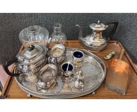 An EPNS four piece tea service, gallery tray, pewter mugs, other plated ware, a hammered copper tray and two oil lamps