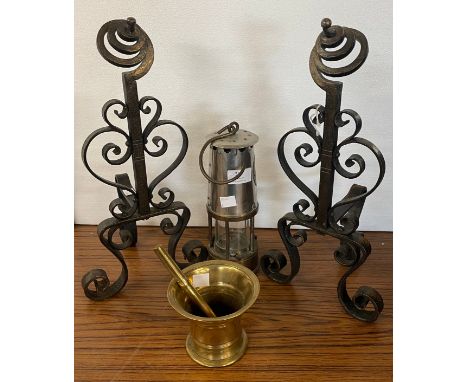 A vintage Eccles miner's lamp, pair of wrought steel fire dogs and a brass pestle and mortar