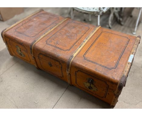 An early 20th Century leather bound travel trunk 