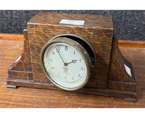 A Smiths of London carved oak mantel clock 