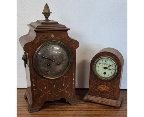 An early 20th Century French inlaid mahogany mantle clock and an inlaid oak timepiece 