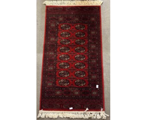 A Royal Keshan red ground runner rug, 163 x 83cms