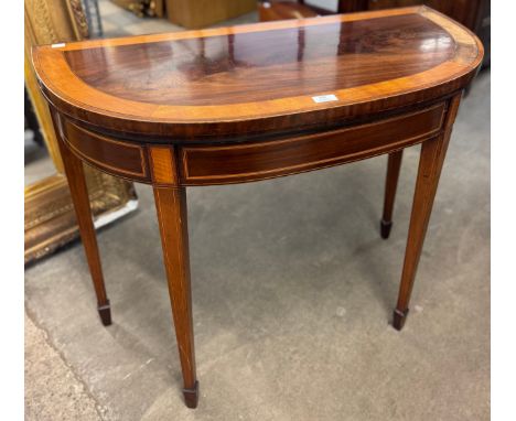 An Edward VII inlaid mahogany foldover card table 