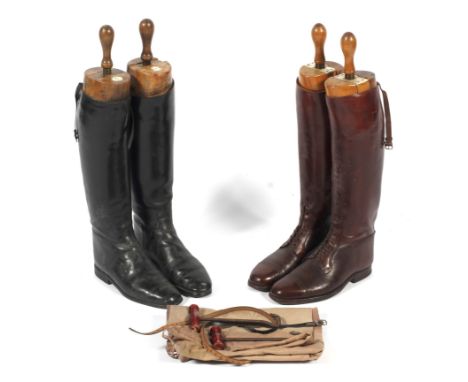 Two pairs of men's leather riding boots with trees, one pair in dust bags. The first pair in dark brown leather with shoe tre