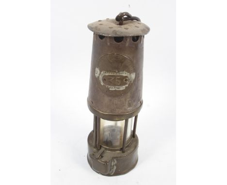 A vintage Eccles (Manchester) The Protector miner's lamp Type SL. Bearing label inscribed The Protector Lamp &amp; Lighting C