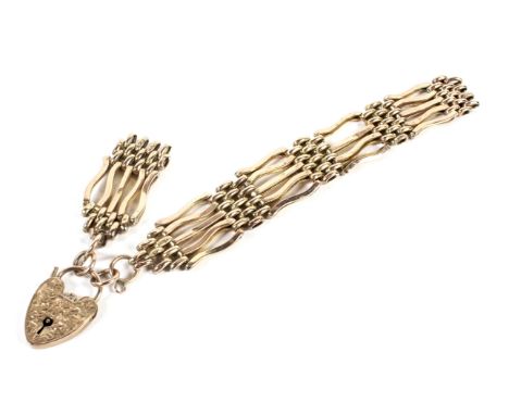 A 9ct gold five bar gate bracelet Hallmarked to eack panel maker W.J.S. 15.8g (needs a repair, link enclosed)