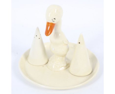 An early 20th century Art Deco Clarice Cliff duck cruet set. Of plain decoration, comprising salt and pepper shakers and stan