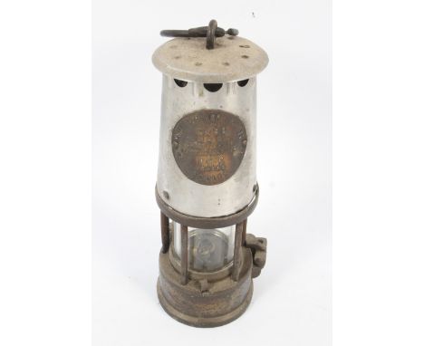 A vintage Eccles (Manchester) The Protector brass miner's lamp Type GR6S . Bearing label inscribed The Protector Lamp & Light