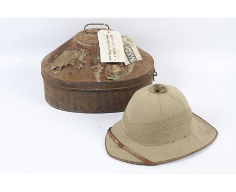 A 1930s British pith helmet. With a khaki six-panel-covered crown, pointed peak and rounded rear brim surrounded by a multi-f