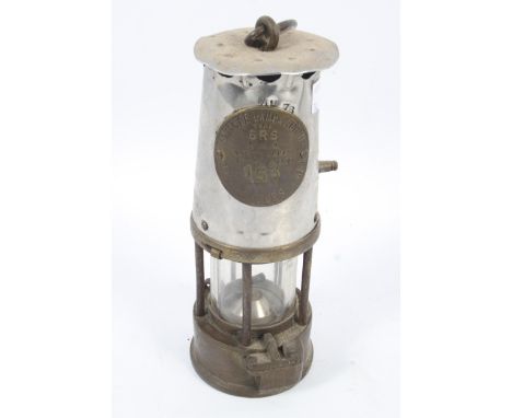 A vintage Eccles (Manchester) The Protector brass miner's lamp Type 6RS. Bearing label inscribed The Protector Lamp & Lightin