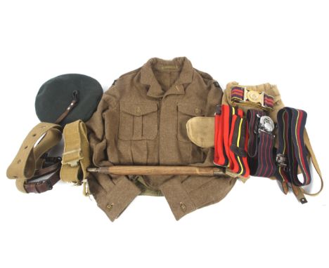 An assortment of military belts and other accessories. Including: a Royal Irish Regiment cap, a Royal Logistics Corps fabric 