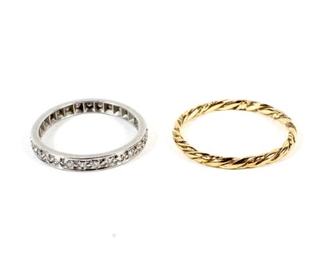 Yellow metal rope twist ring 1.1 grams, size N and white metal and diamond ring 2.2 grams, size K.