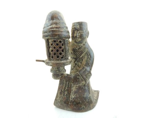 A Chinese bronze incense burner, fashioned as a man holding a lantern. H. 20cm