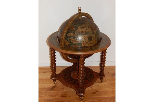 A Globe Drinks Cabinet The Hinged Top Enclosing A Bottle Interior On A globe drinks cabinet the hinged top enclosing a bottle interior on spiral turned legs. - A Globe Drinks Cabinet The Hinged Top Enclosing A Bottle Interior On