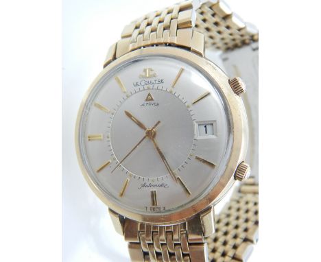 A gentleman's gold plated Jaeger LeCoultre Memovox alarm watch, the silvered dial with gilt baton markers, date aperture at t