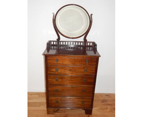 A 20th century mahogany dressing chest, Maple & Co., the raised back with a circular mirror and pierced gallery above an arra