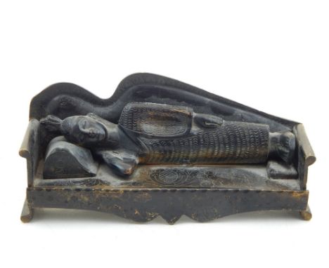 A Chinese bronze of a sleeping Buddha. L. 26cm