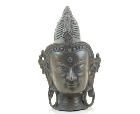 A bronze Buddhist head. H. 23cm