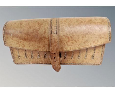 A vintage 1952 military hand machine stitched leather pouch fitted to house ammunition 