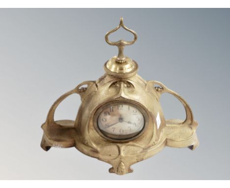 A brass Art Nouveau mantel clock, width 35 cm. 