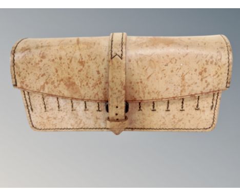 A vintage 1954 military hand machine stitched leather pouch fitted to house ammunition 