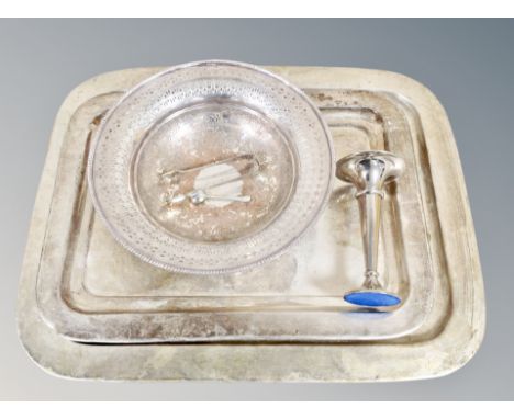 Two silver plated serving trays together with a pedestal bowl, weighted trumpet vase, tongs and caddy spoon 