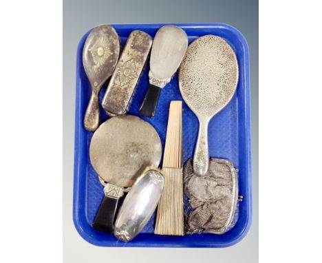 A tray of six silver-plated backed dressing table hand mirrors and brushes, a further folding hand fan and a chain mail purse