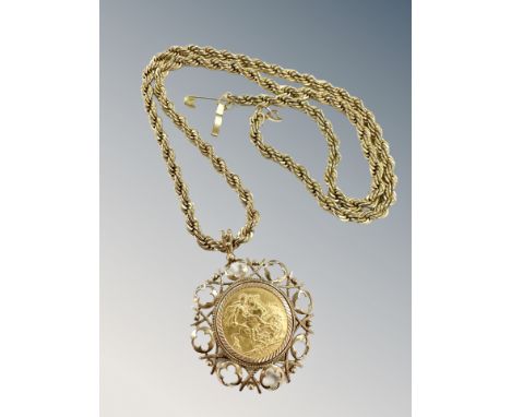 A George V full sovereign 1912 in 9ct gold mount, upon a gold-plated rope-twist chain.  CONDITION REPORT: Sovereign and penda