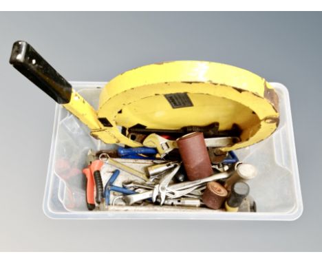 A box containing a small quantity of hand tools, steering wheel lock.