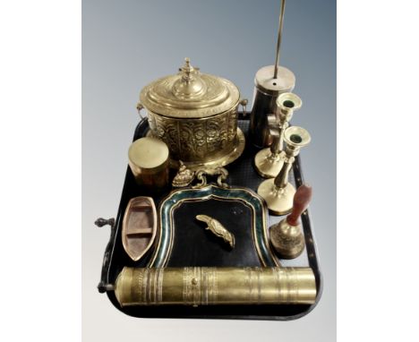 A tray of brassware including a pair of candlesticks, pepper grinder, toleware crumb scoop etc. 