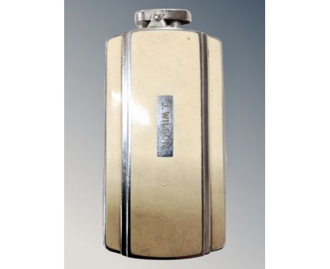 A Ronson combination lighter/cigarette case, enamelled, bearing name J. Wilson 