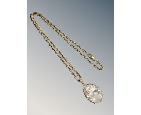 A 9ct gold crystal pendant on similar chain CONDITION REPORT: 13.3g gross