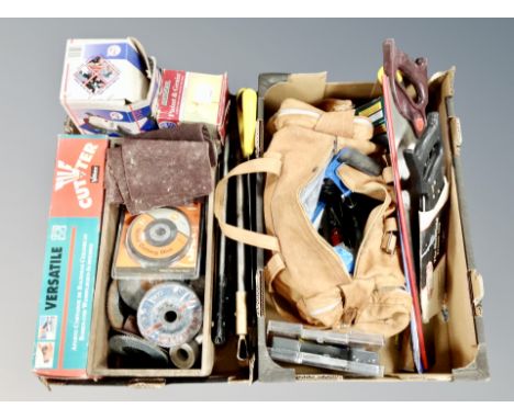 Two boxes containing tool including hand saws, angle grinding disks, leather tool bag of assorted hand tools. 